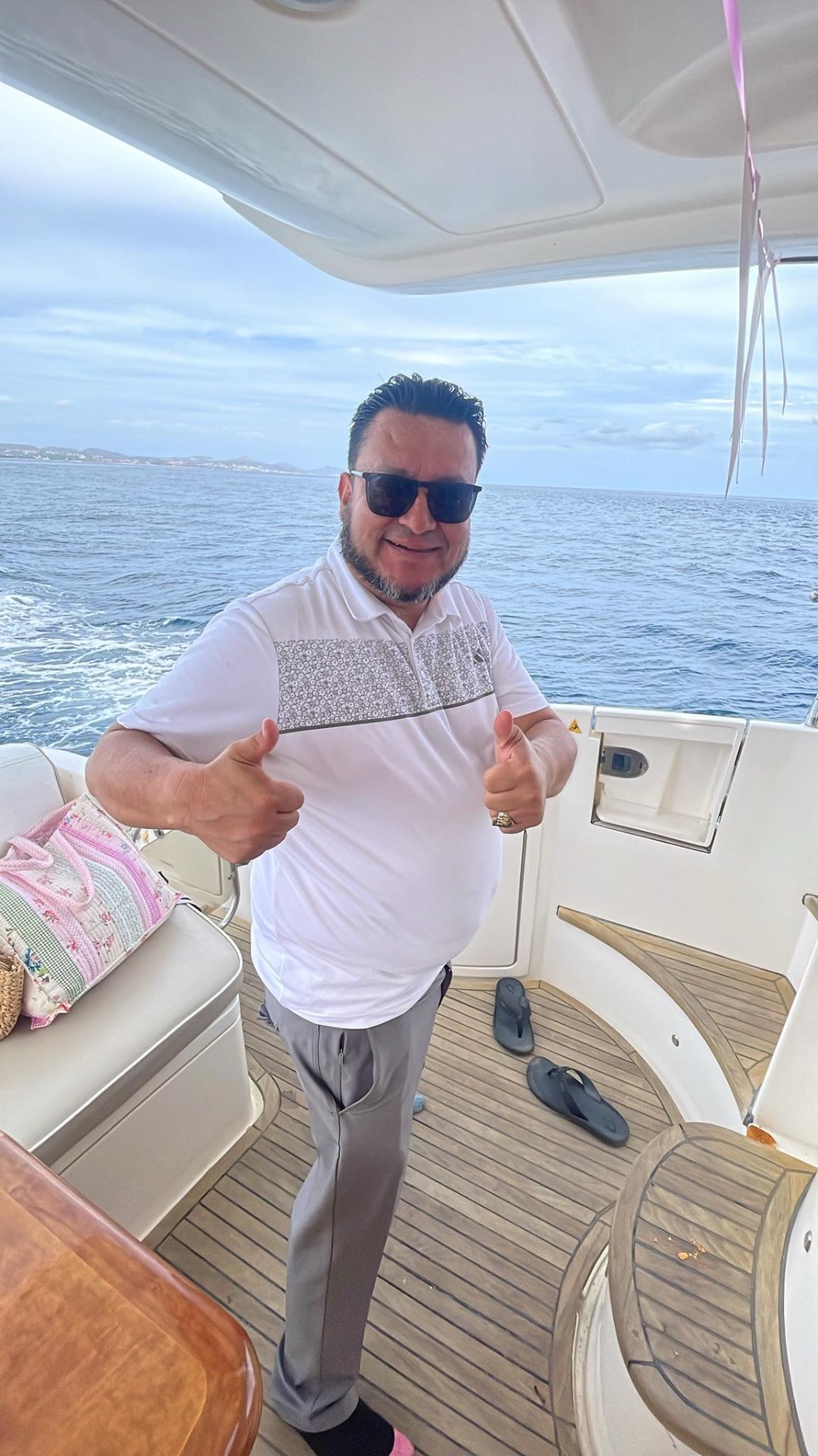 David giving thumbs up on a private yacht